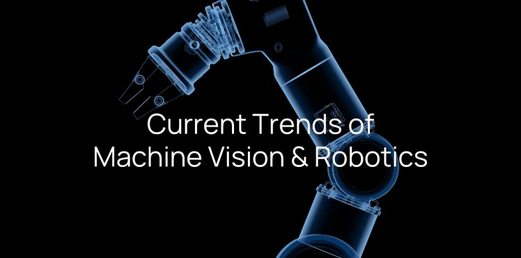 Robotic arm with machine vision system inspecting products on a manufacturing line